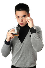 Image showing Young man with a glass. Isolated