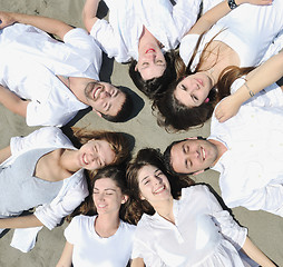 Image showing Group of happy young people in have fun at beach