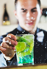 Image showing pro barman prepare coctail drink on party