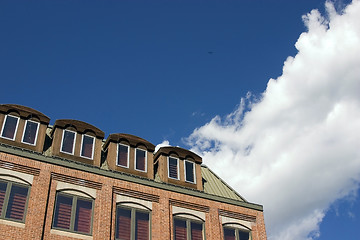 Image showing Close up on a building with Clouds