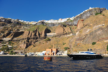 Image showing santorini island coast with luxury yacht