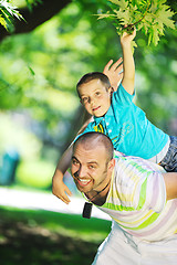 Image showing happy father and son have fun at park