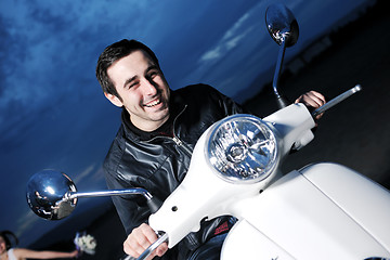 Image showing young man ride retro scooter