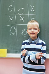 Image showing happy young boy at first grade math classes 