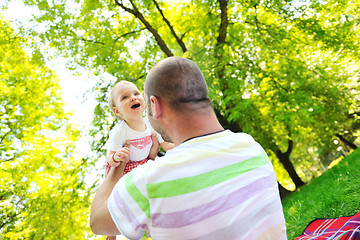 Image showing man and baby playing in park