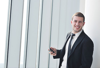 Image showing young business man talk by cellphone