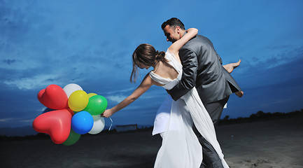 Image showing romantic beach wedding at sunset