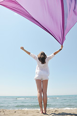 Image showing beautiful young woman on beach with scarf