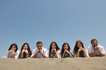 Image showing Group of happy young people in have fun at beach