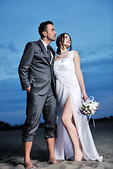 Image showing romantic beach wedding at sunset