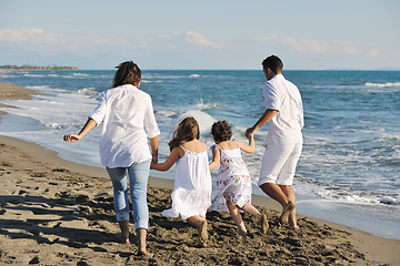 Image showing happy young  family have fun on beach