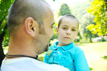 Image showing happy father and son have fun at park