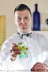 Image showing pro barman prepare coctail drink on party