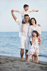 Image showing happy young family have fun on beach