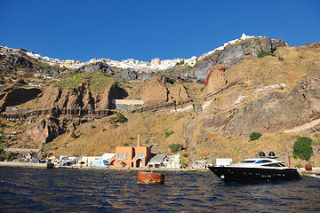 Image showing santorini island coast with luxury yacht