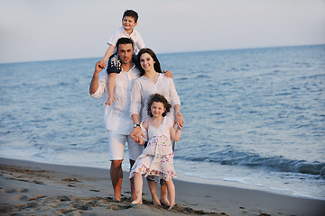 Image showing happy young family have fun on beach