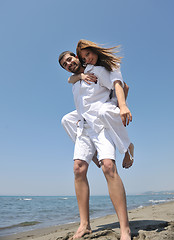 Image showing happy young couple have fun on beach