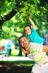 Image showing happy father and son have fun at park