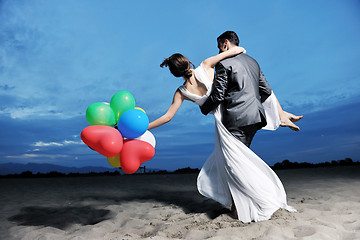 Image showing romantic beach wedding at sunset