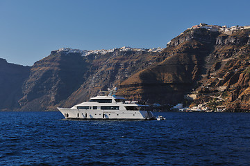 Image showing santorini island coast with luxury yacht