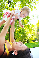 Image showing woman and baby have playing at park