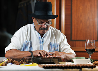 Image showing man making luxury handmade cuban cigare