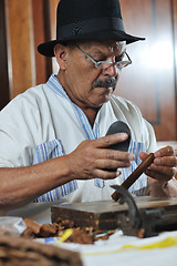 Image showing man making luxury handmade cuban cigare