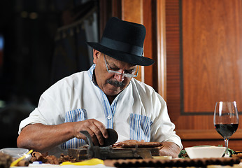 Image showing man making luxury handmade cuban cigare