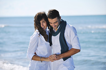 Image showing happy young couple have fun at beautiful beach