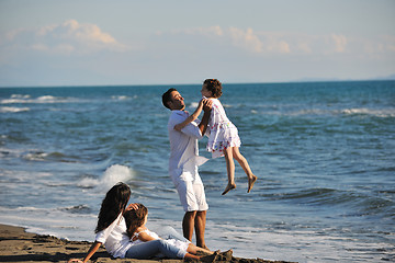 Image showing happy young  family have fun on beach