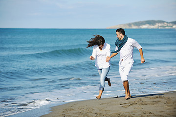 Image showing happy young couple have fun at beautiful beach