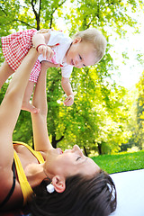 Image showing woman and baby have playing at park