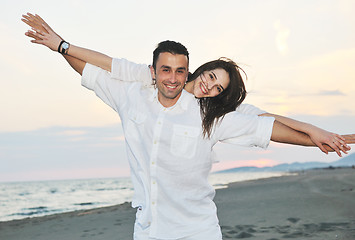 Image showing happy young couple have fun on beach