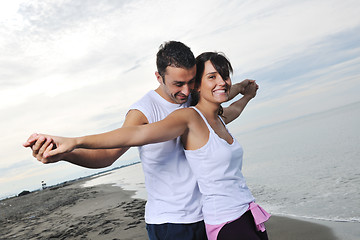 Image showing happy young couple have fun at beautiful beach