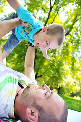 Image showing happy father and son have fun at park