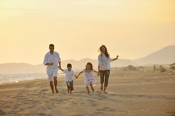 Image showing happy young family have fun on beach