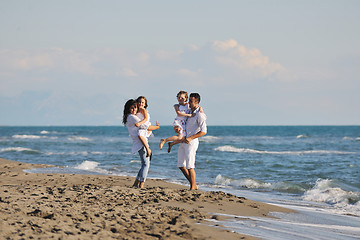 Image showing happy young  family have fun on beach