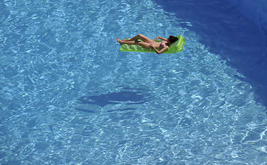 Image showing woman relax at swimming pool 