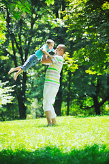 Image showing happy father and son have fun at park