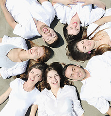 Image showing Group of happy young people in have fun at beach