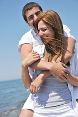 Image showing happy young couple have fun on beach