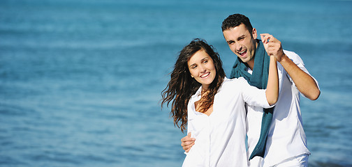 Image showing happy young couple have fun at beautiful beach