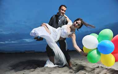 Image showing romantic beach wedding at sunset