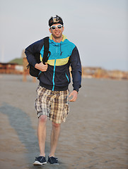 Image showing man walk on beach