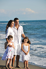 Image showing happy young  family have fun on beach