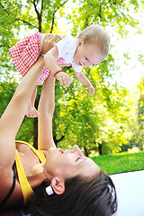 Image showing woman and baby have playing at park