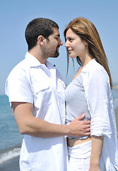 Image showing happy young couple have fun on beach