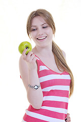 Image showing happy  young  woman eat green apple isolated  on white