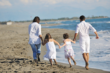 Image showing happy young  family have fun on beach