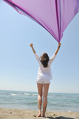 Image showing beautiful young woman on beach with scarf